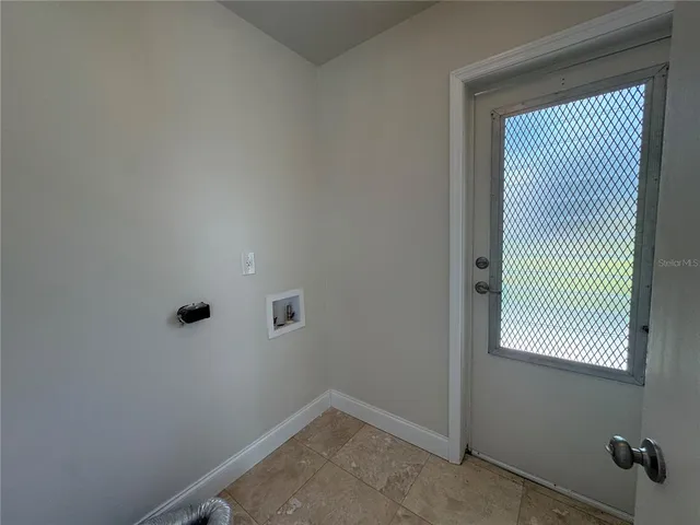 a view of a room that has a window in it