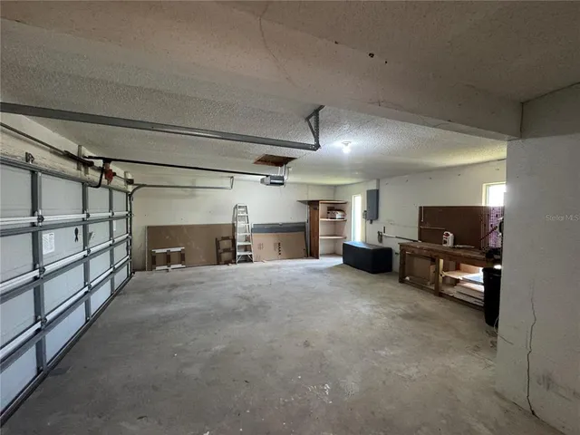 a view of a livingroom with furniture and a flat screen tv