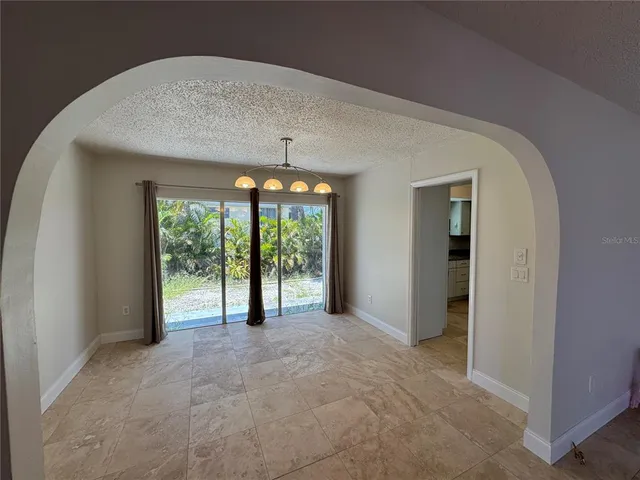 a view of an empty room with a sliding door