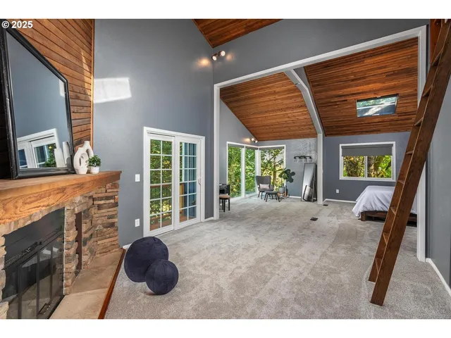 a view of livingroom with furniture and a large window