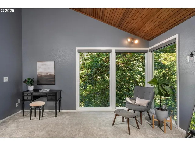 a work room with furniture and a window