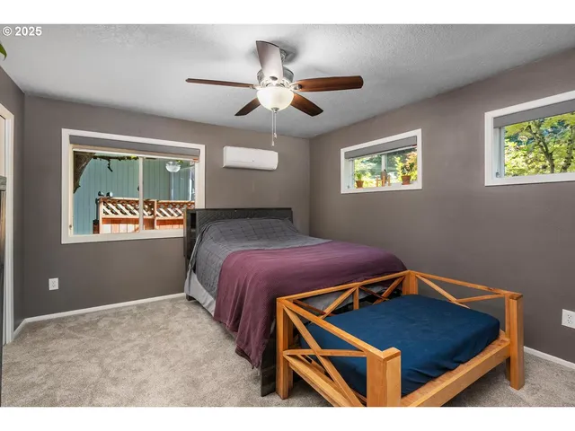 a room with window and ceiling fan