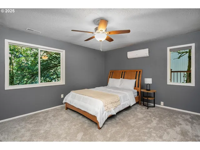 a bedroom with a bed and window