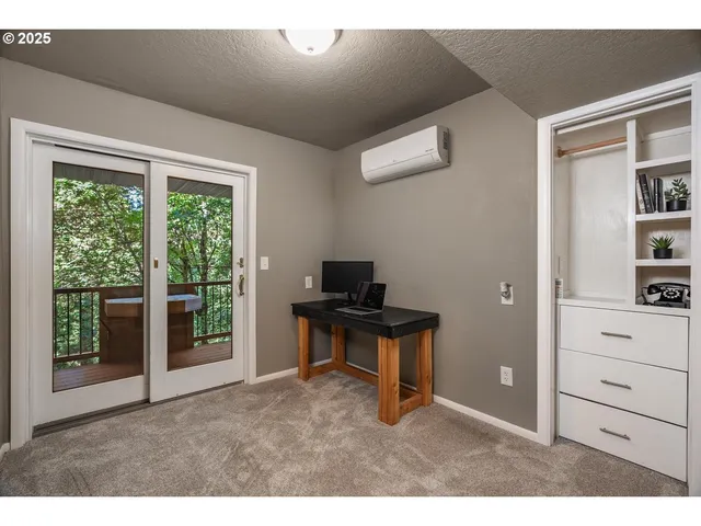 a balcony with wooden floor and outdoor space