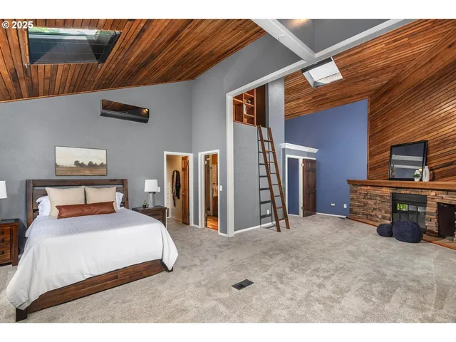 a bedroom with bed and a couch