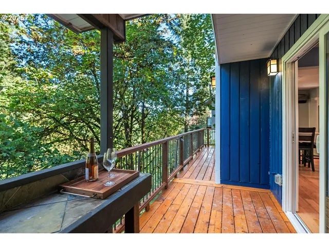 a view of balcony with wooden floor and outdoor space