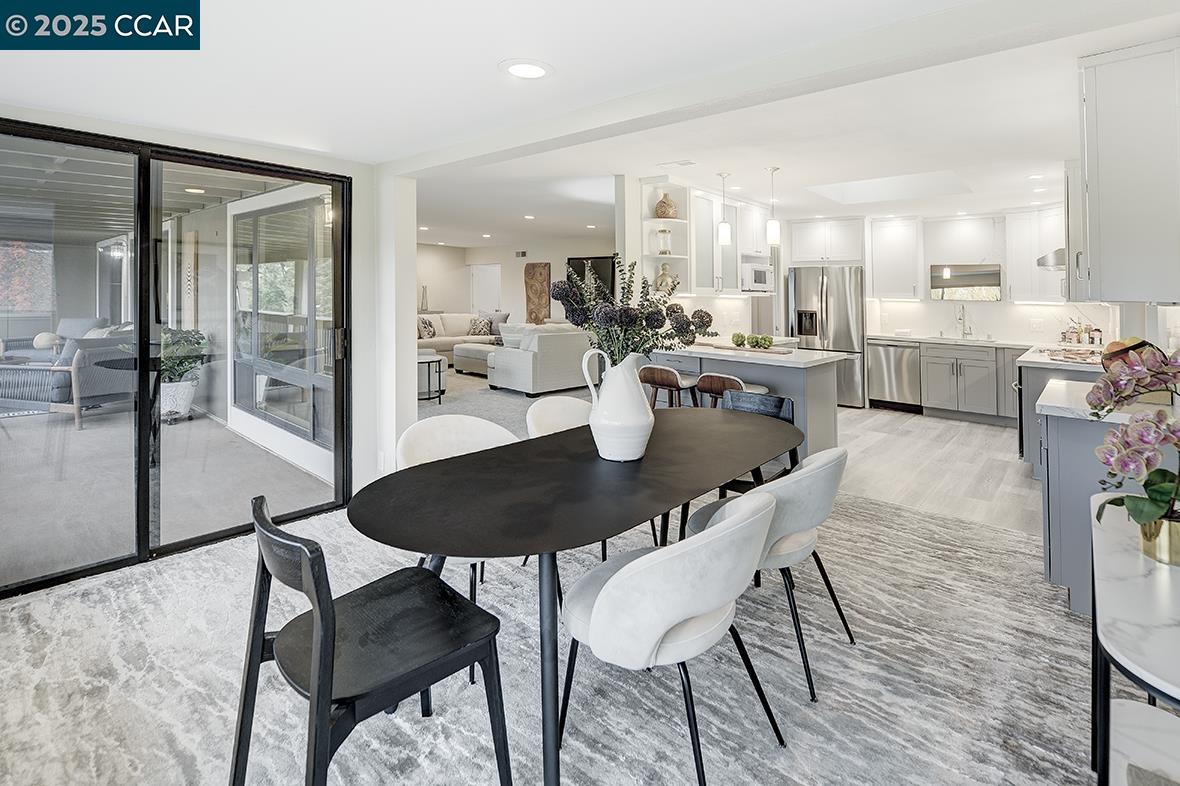 2900 Tice Creek Drive, Unit 1 & 3 Walnut Creek, CA 94595 - Photo 11 of 58 a dining room with furniture and wooden floor
