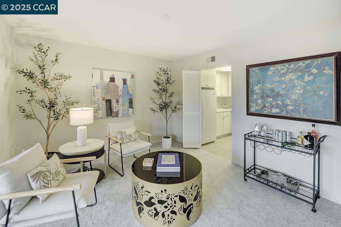 2900 Tice Creek Drive, Unit 1 & 3 Walnut Creek, CA 94595 - Photo 15 of 58 a living room with furniture and a flat screen tv