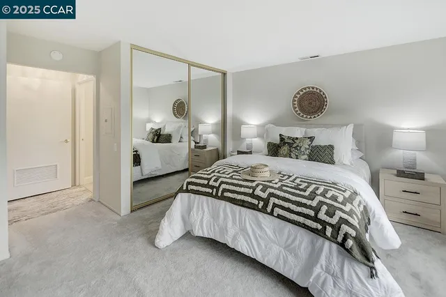a bathroom with double vanity sinks a vanity two mirror and a shower