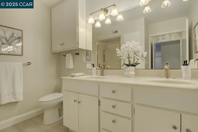 a view interior of kitchen and hall with wooden floor