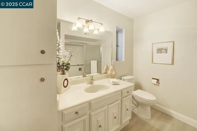 a kitchen with stainless steel appliances kitchen island granite countertop a stove and a refrigerator