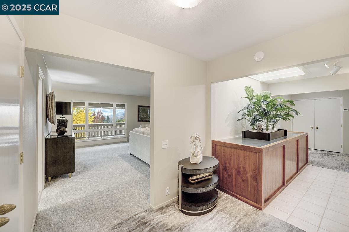 2900 Tice Creek Drive, Unit 1 & 3 Walnut Creek, CA 94595 - Photo 52 of 58 a kitchen with stainless steel appliances kitchen island granite countertop a stove and a refrigerator