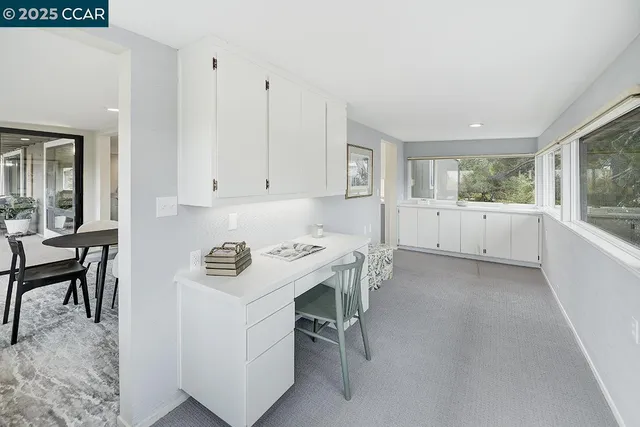 a room with a window and washer