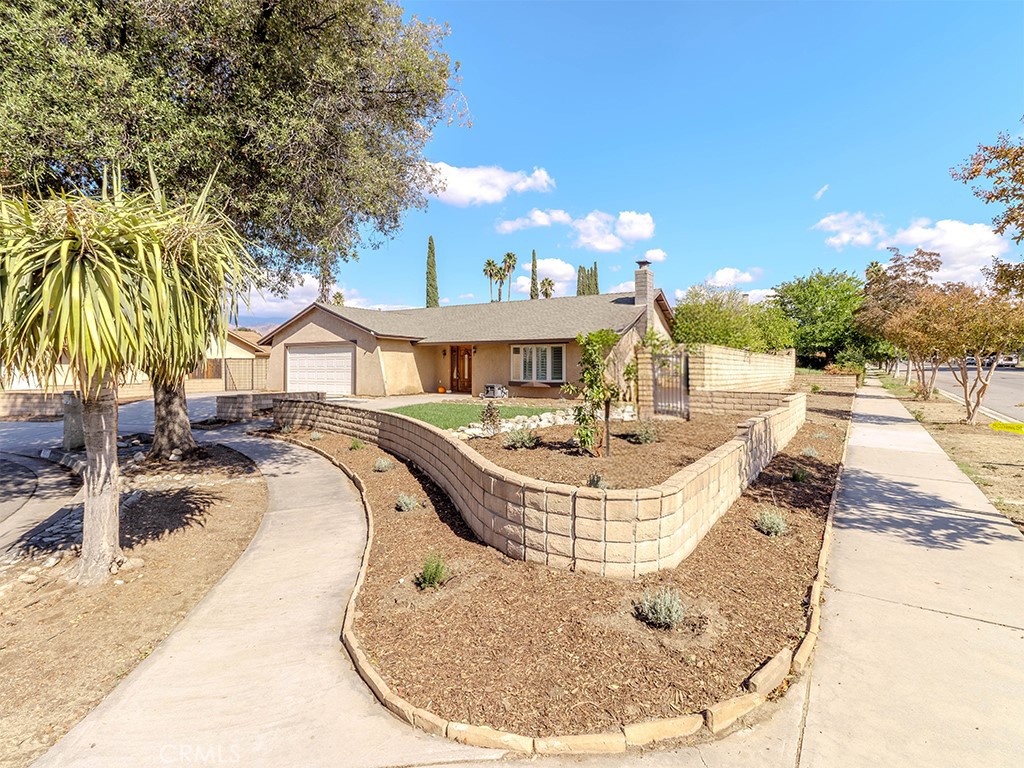 802 Renee Street Redlands, CA 92374 - Photo 3 of 18 a view of a swimming pool with a chair and tables