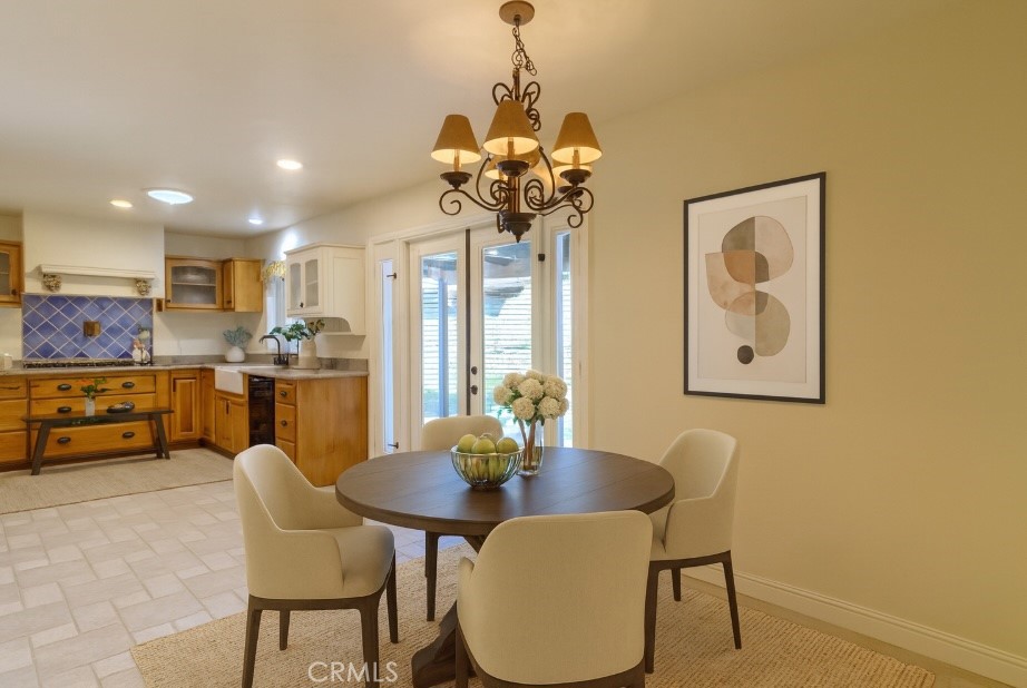 802 Renee Street Redlands, CA 92374 - Photo 4 of 18 a view of a dining room with furniture and a chandelier