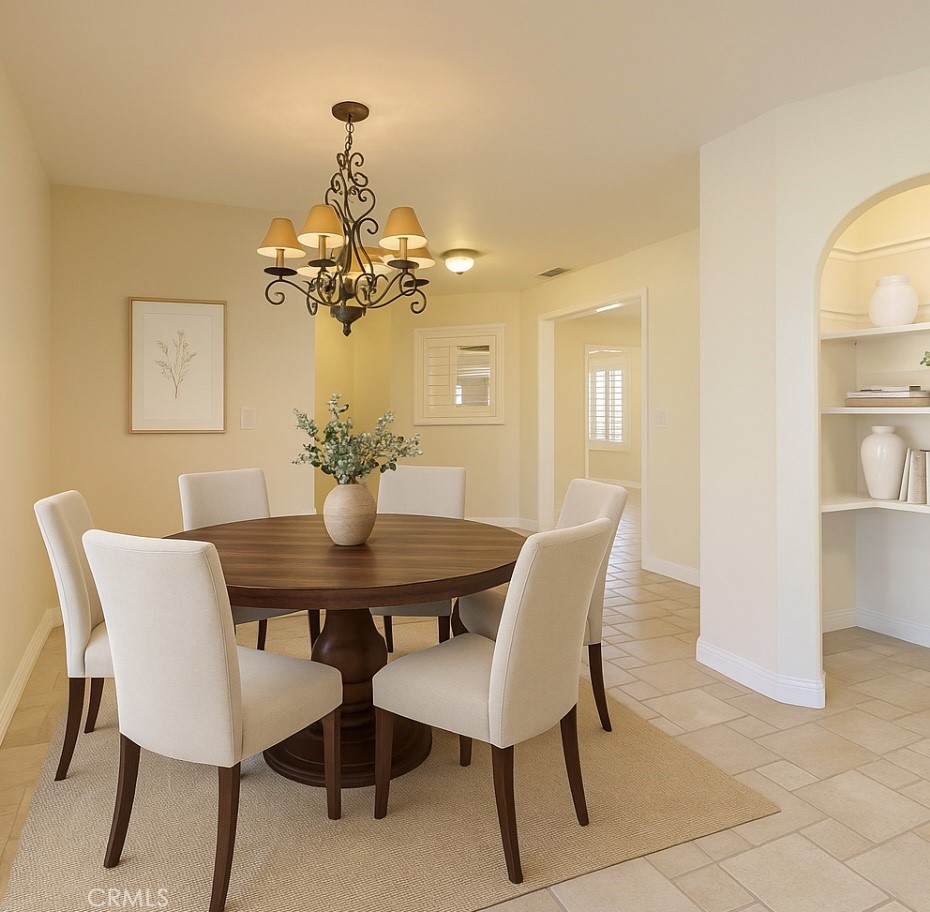 802 Renee Street Redlands, CA 92374 - Photo 6 of 18 a dining room with furniture and chandelier