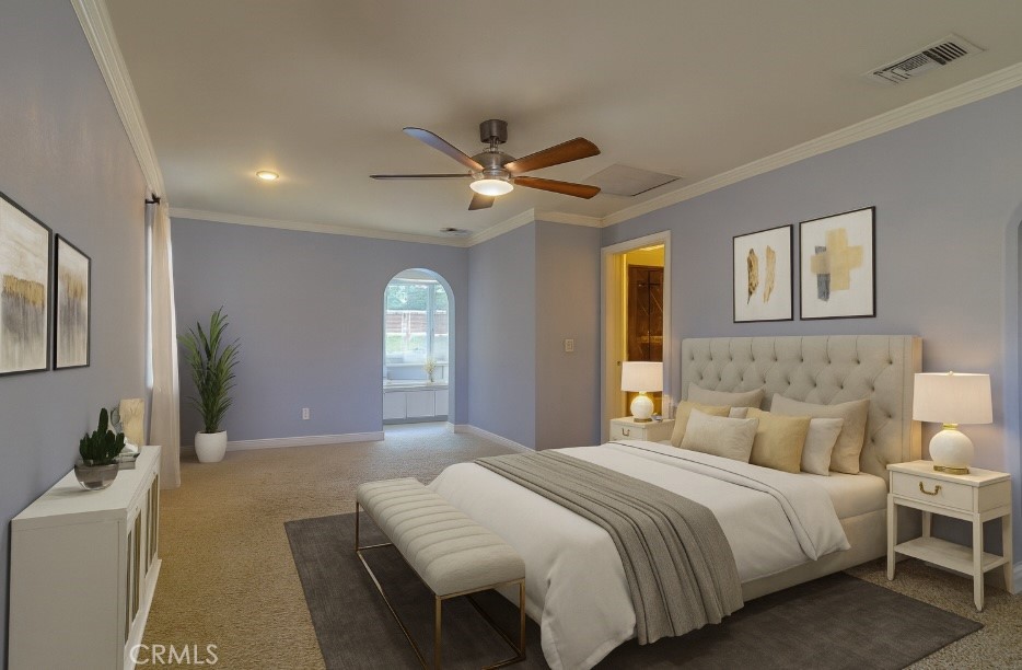 802 Renee Street Redlands, CA 92374 - Photo 8 of 18 a bedroom with bed and a chandelier