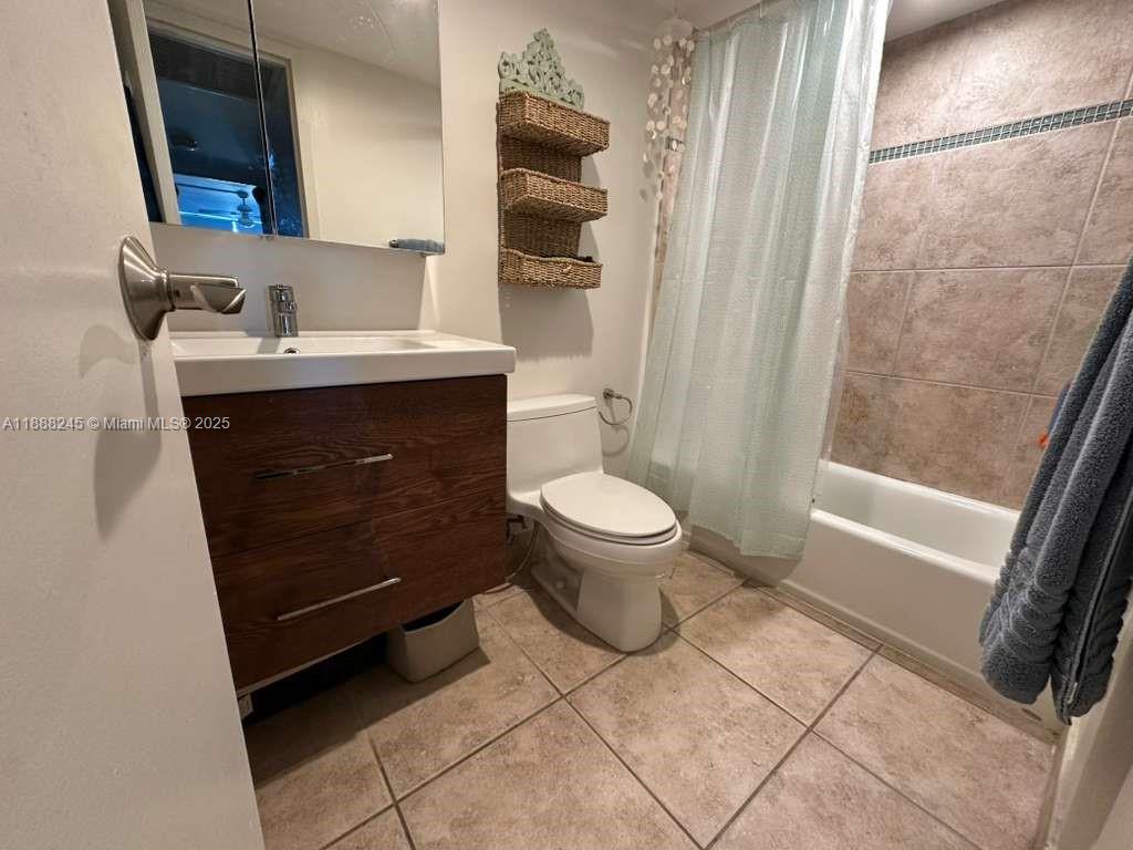1000 Parkview Drive, Unit 627 Hallandale Beach, FL 33009 - Photo 11 of 27 a bathroom with a sink a toilet a mirror and shower