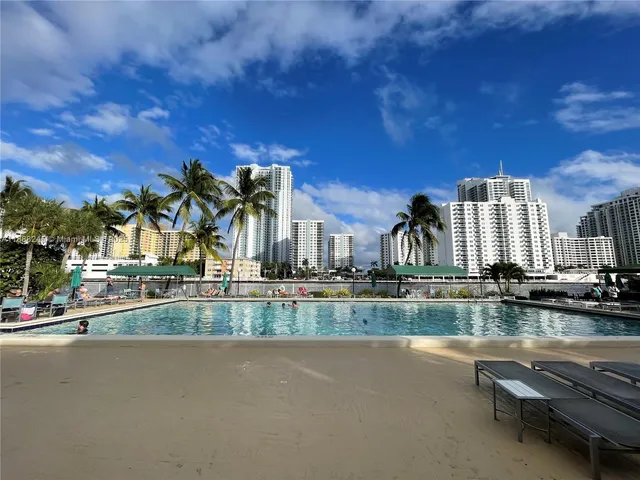 a view of a lake with a building in the background