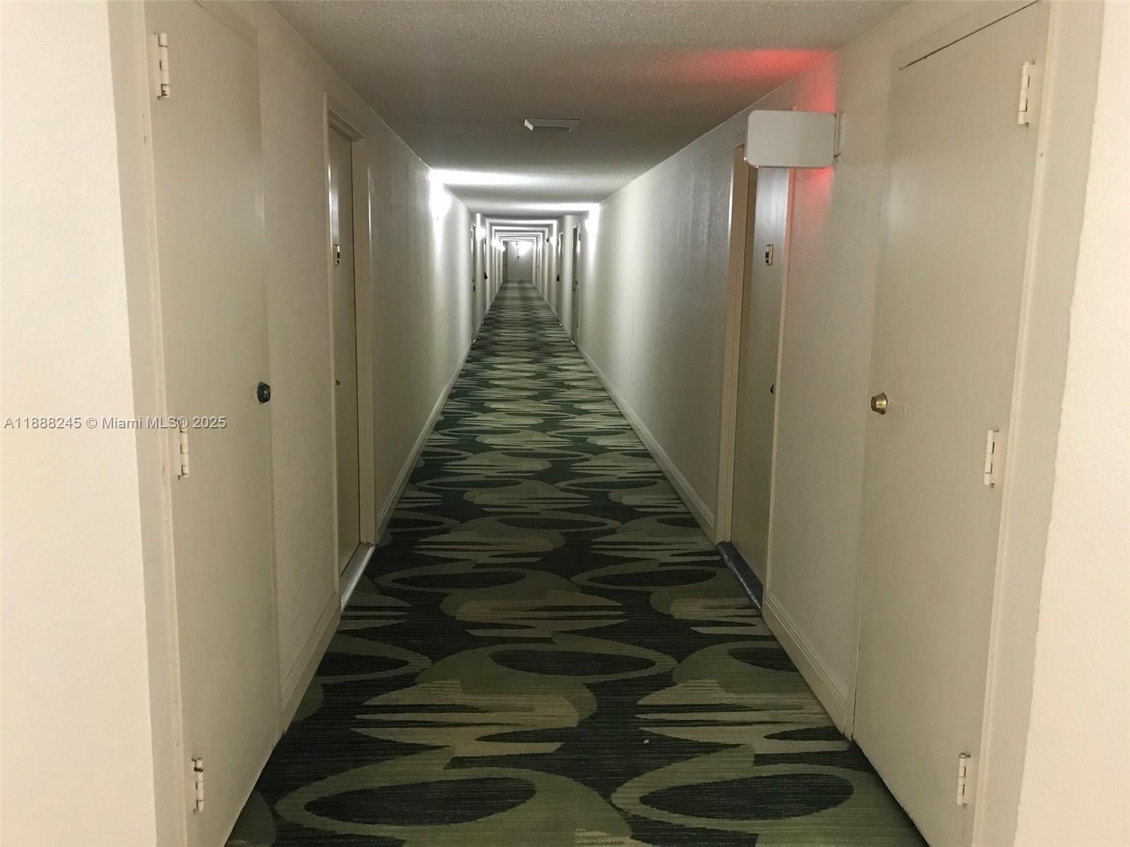 1000 Parkview Drive, Unit 627 Hallandale Beach, FL 33009 - Photo 24 of 27 a view of entryway and hall with wooden floor