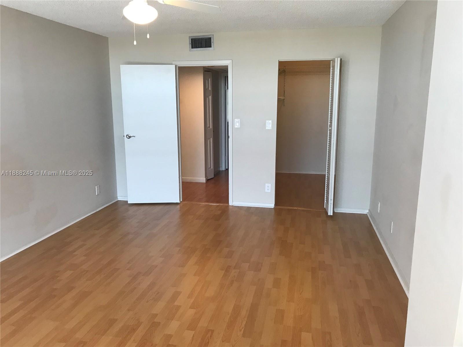1000 Parkview Drive, Unit 627 Hallandale Beach, FL 33009 - Photo 6 of 27 a view of an empty room with wooden floor