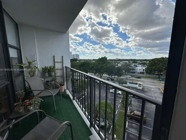 a view of a balcony and chairs
