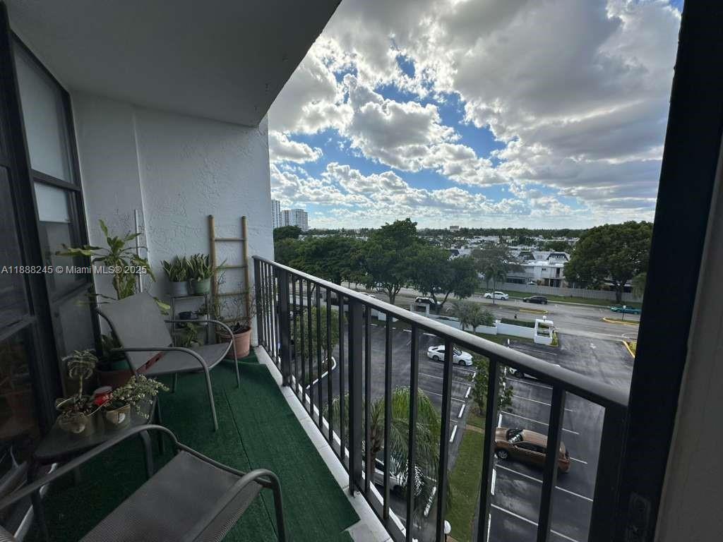 1000 Parkview Drive, Unit 627 Hallandale Beach, FL 33009 - Photo 8 of 27 a view of a balcony and chairs