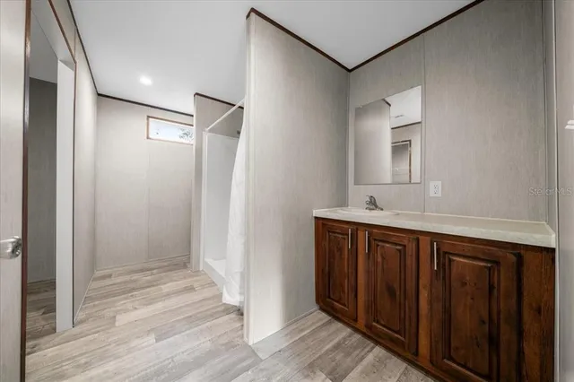 a bathroom with a double vanity sink and mirror