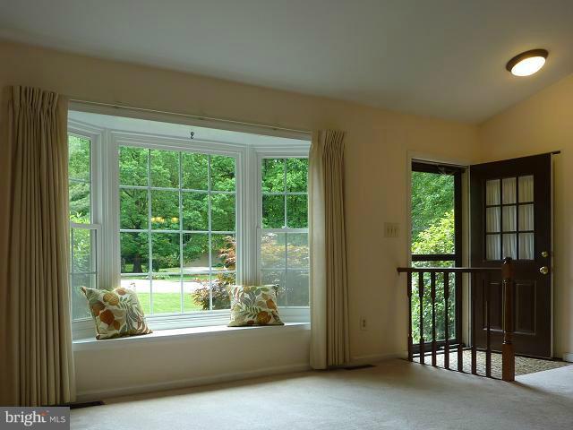 12351 Lima Lane Reston, VA 20191 - Photo 15 of 28 a view of a bathtub in a big room with wooden floor and windows