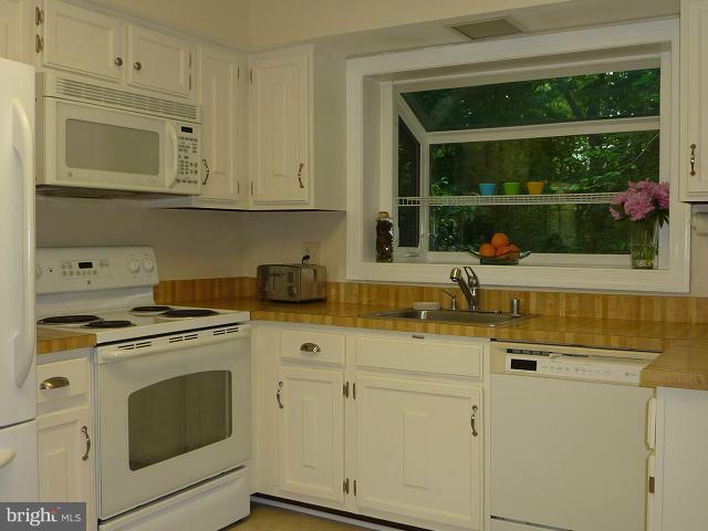 12351 Lima Lane Reston, VA 20191 - Photo 5 of 28 a kitchen with appliances cabinets and a sink