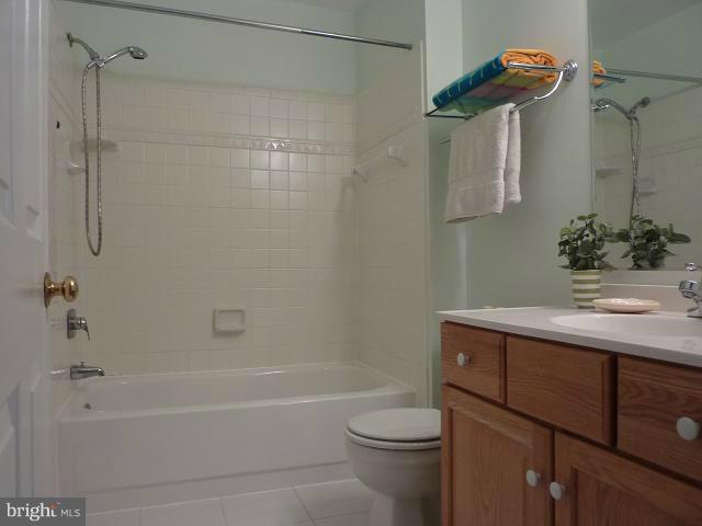 12351 Lima Lane Reston, VA 20191 - Photo 6 of 28 a bathroom with a sink a toilet and shower