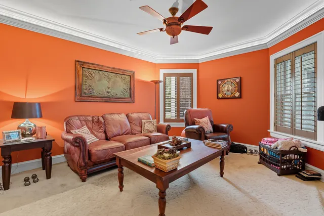 a living room with furniture a table and a window