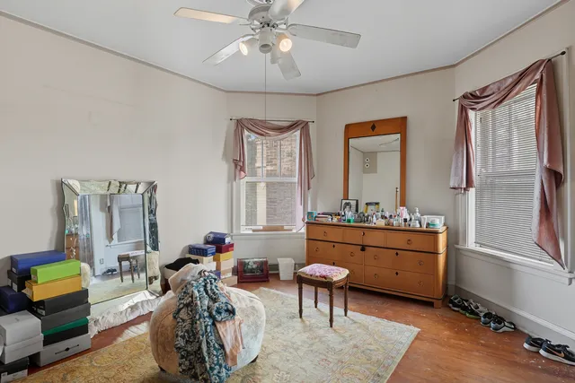a room with furniture a rug and a window