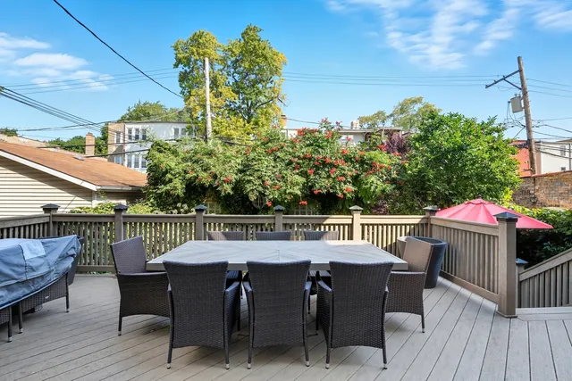 a view of a chairs and table on the deck
