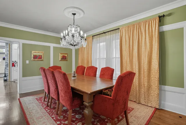 a living room with furniture a table and a window