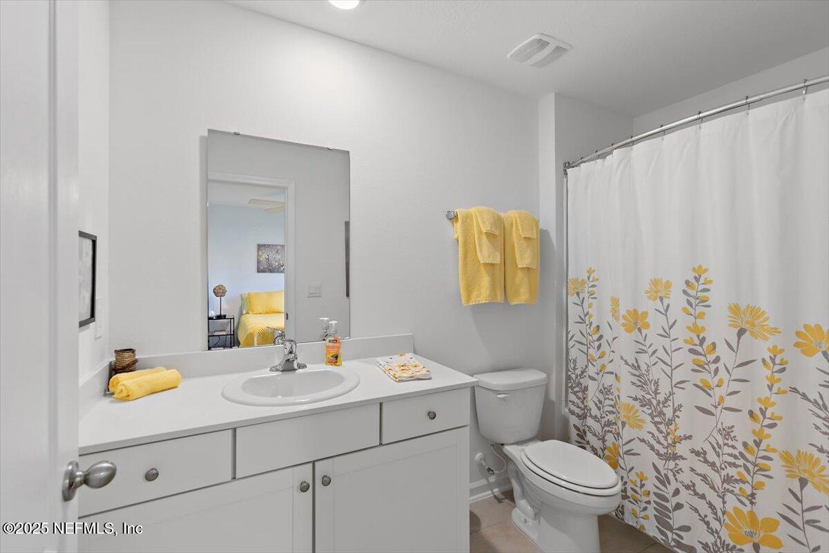 120 Seaport Breeze Rd Street St. Augustine, FL 32095 - Photo 14 of 25 a bathroom with a sink toilet and shower