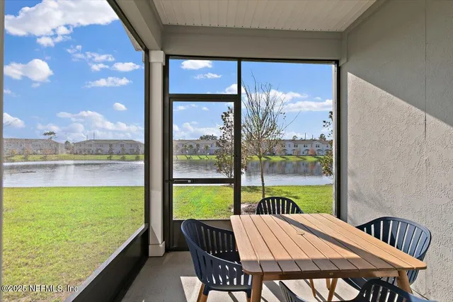 a view of an outdoor space with furniture and garden