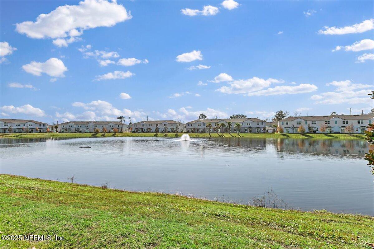 120 Seaport Breeze Rd Street St. Augustine, FL 32095 - Photo 18 of 25 a view of a lake with a city