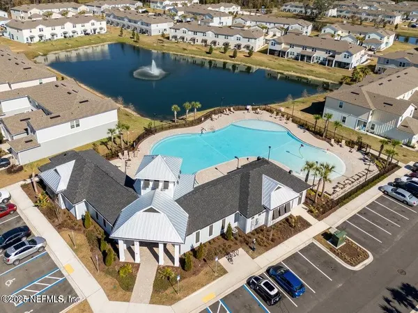 a view of a swimming pool with outdoor seating space