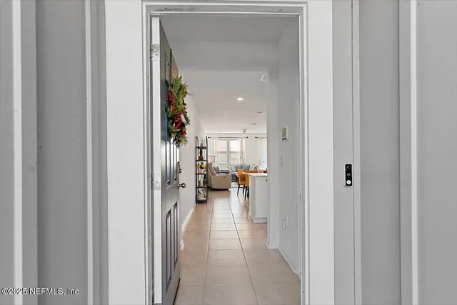 a view of a hallway with living room and furniture