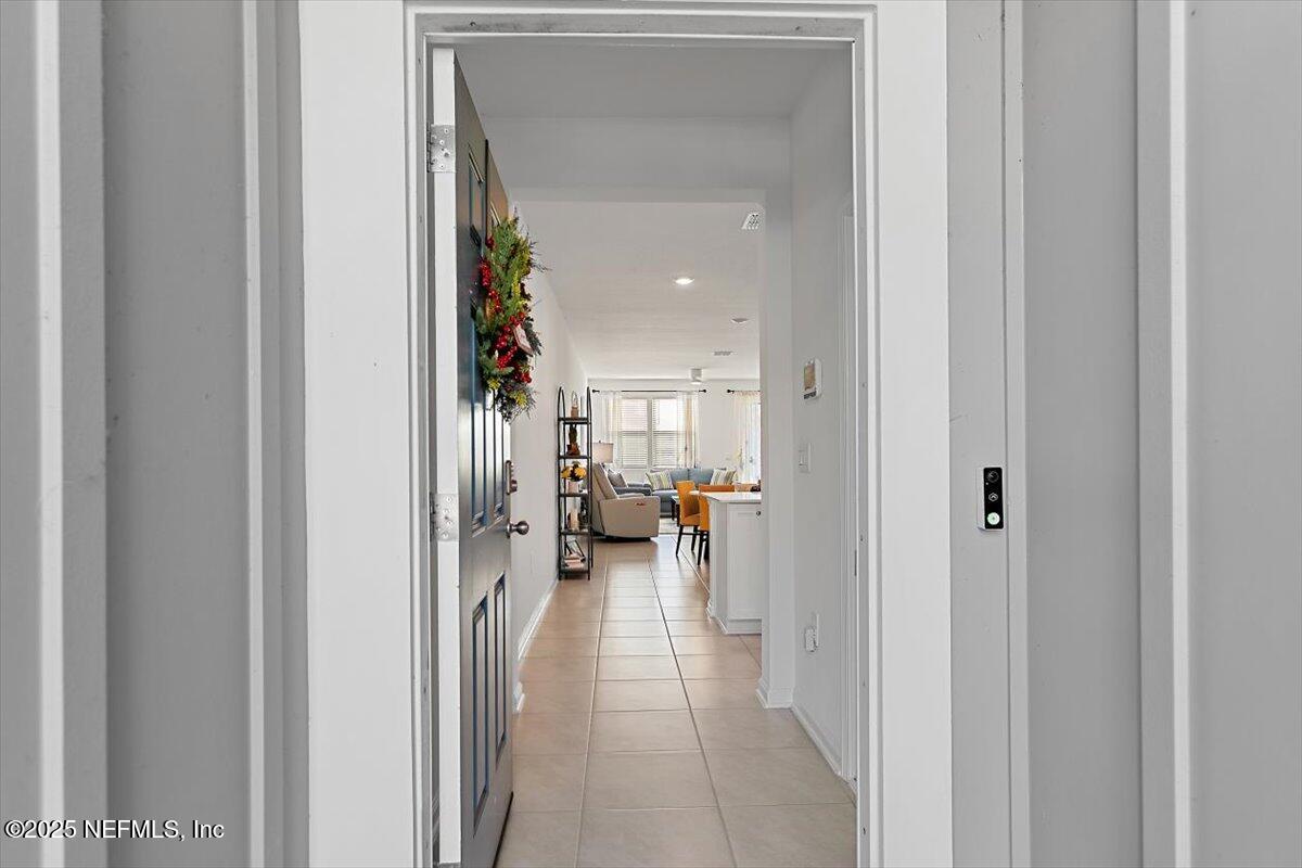 120 Seaport Breeze Rd Street St. Augustine, FL 32095 - Photo 2 of 25 a view of a hallway with living room and furniture