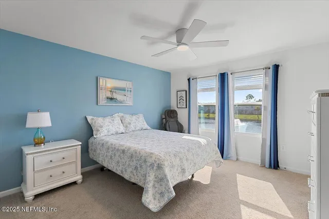 a bed room with a bed and a window