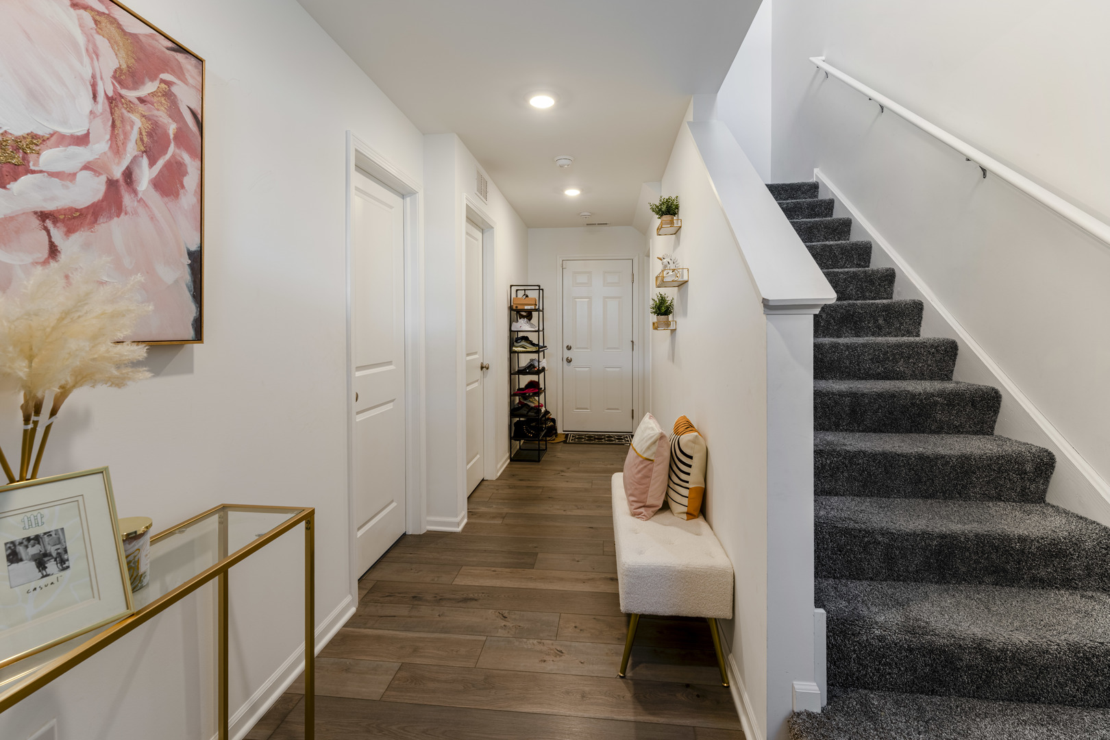 482 Comstock Road South Elgin, IL 60177 - Photo 3 of 23 a hallway with a white walls and stairs
