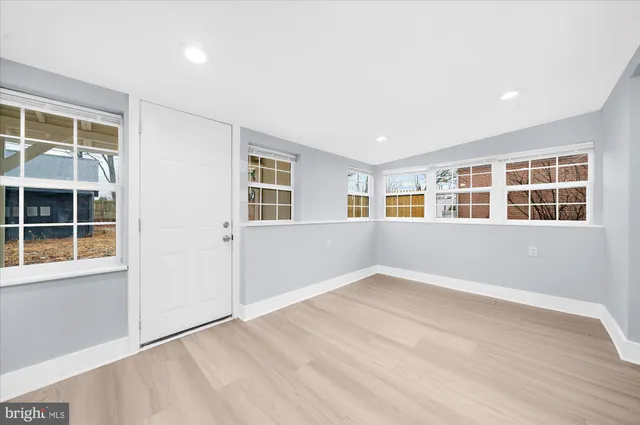 a view of empty room with windows