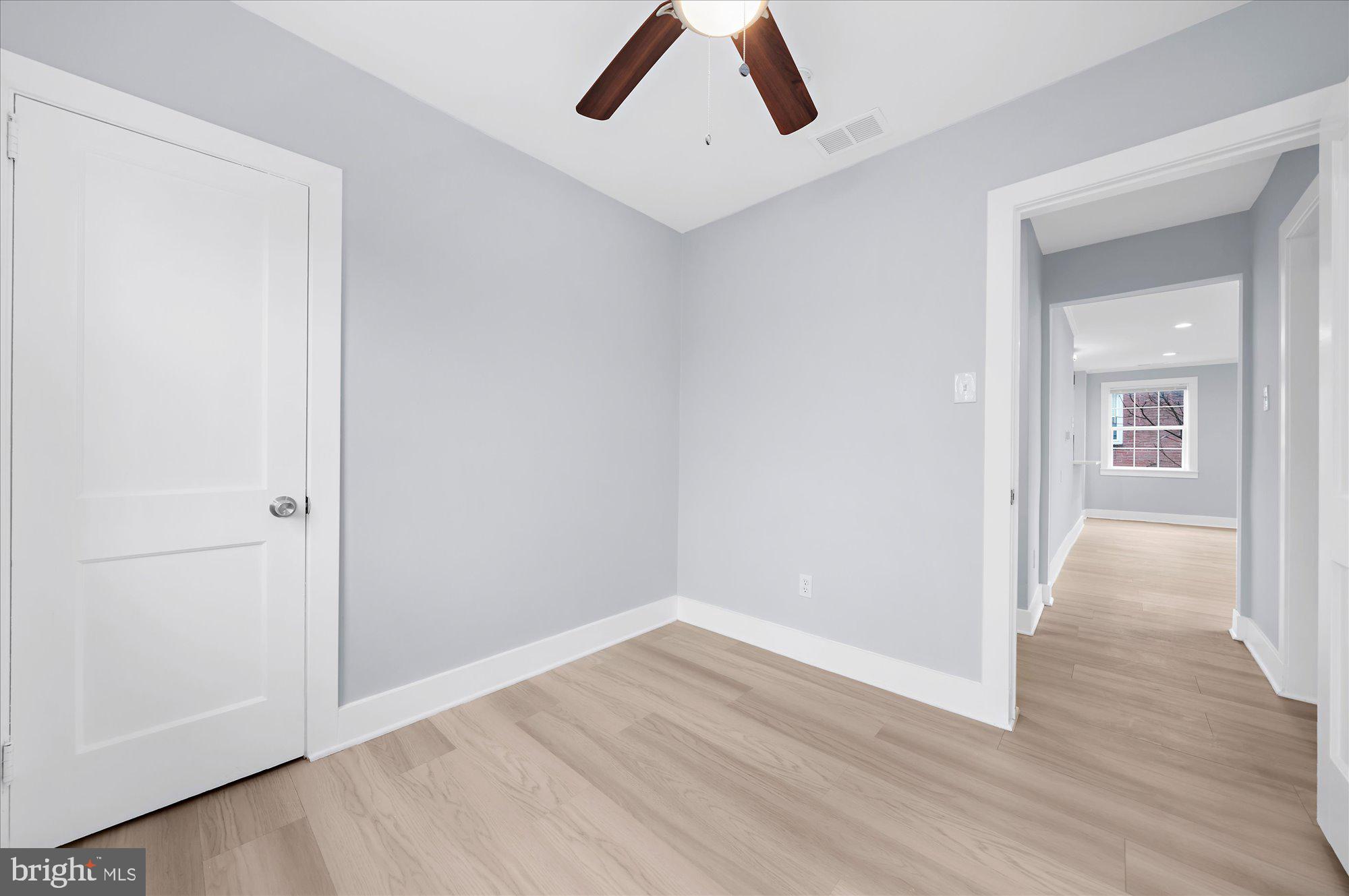 733 West County Line Road Horsham, PA 19044 - Photo 17 of 24 an empty room with wooden floor and windows