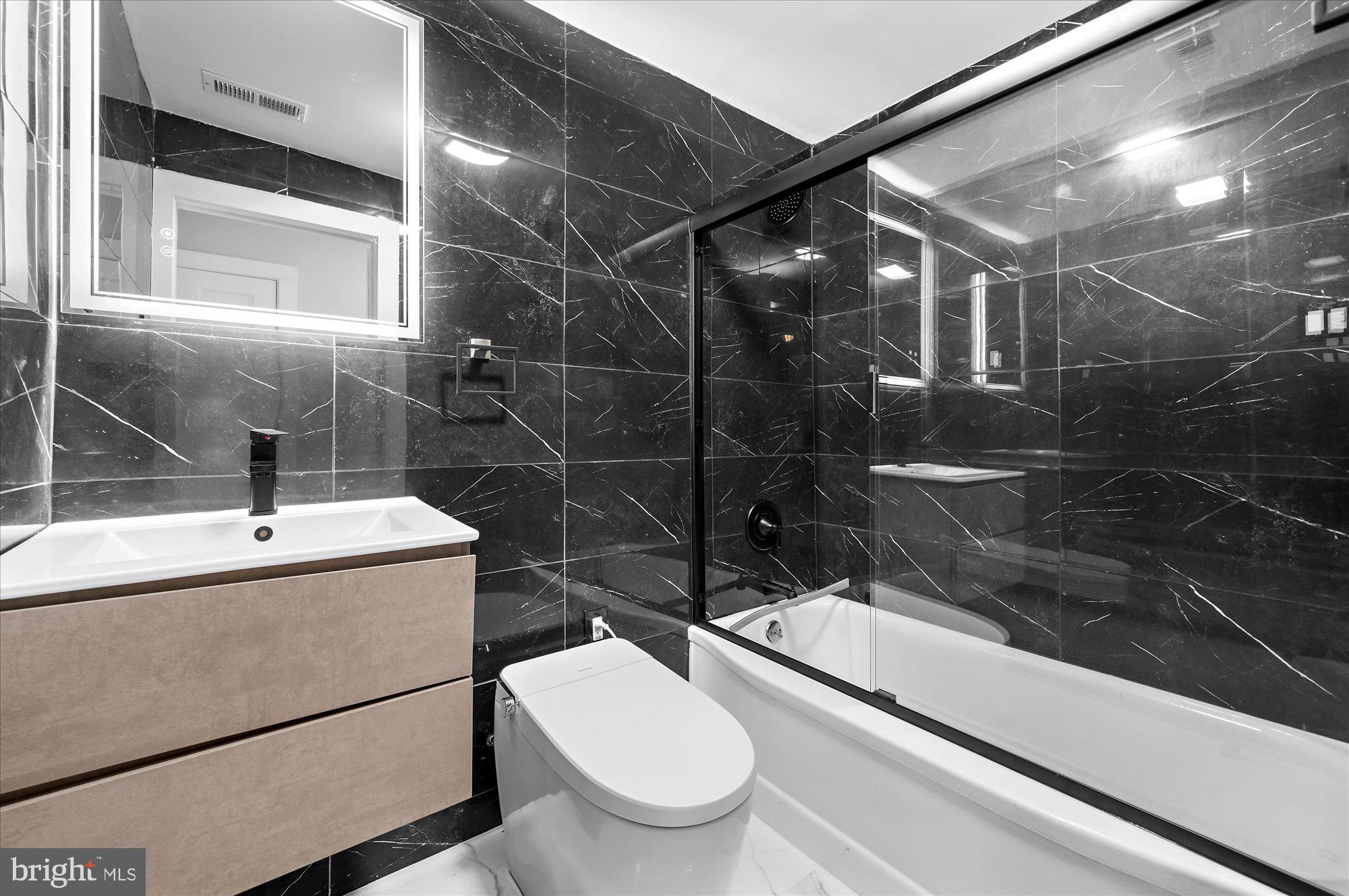 733 West County Line Road Horsham, PA 19044 - Photo 20 of 24 a bathroom with a sink toilet and shower