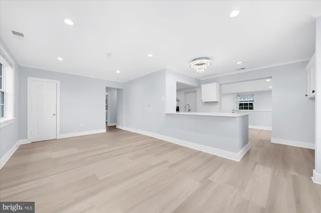 a view of a kitchen with a sink and a window