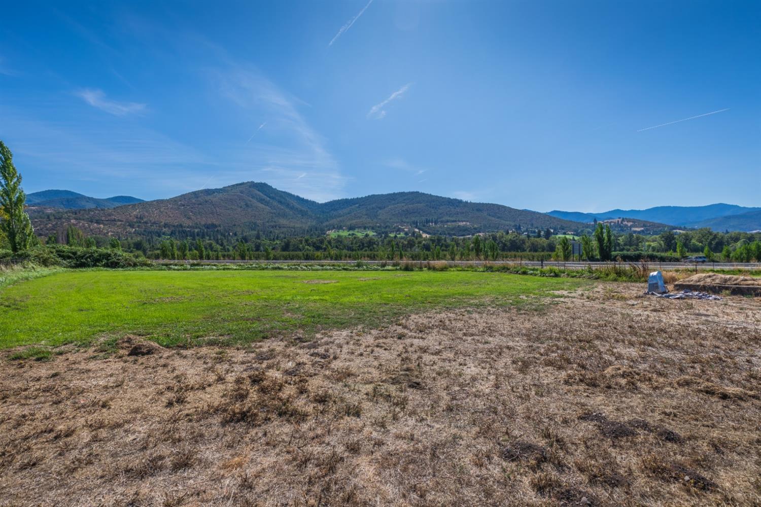 728 West Valley View Road Ashland, OR 97520 - Photo 5 of 32 a view of a house with a yard and a lake view