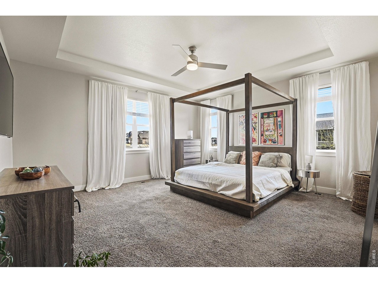 1699 Rivergate Way Berthoud, CO 80513 - Photo 12 of 45 a living room with a bed furniture and a window