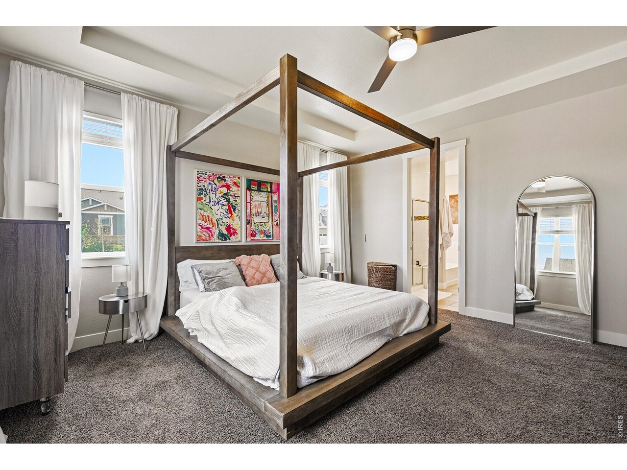 1699 Rivergate Way Berthoud, CO 80513 - Photo 13 of 45 a bed room with a bed and a painting